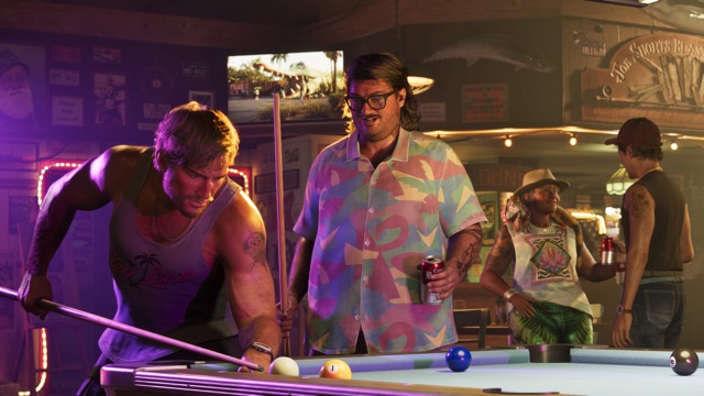A man in a tank top lining up a shot at a pool table in a bar while Cal Hampton, holding a cue and a can of beer, looks on.