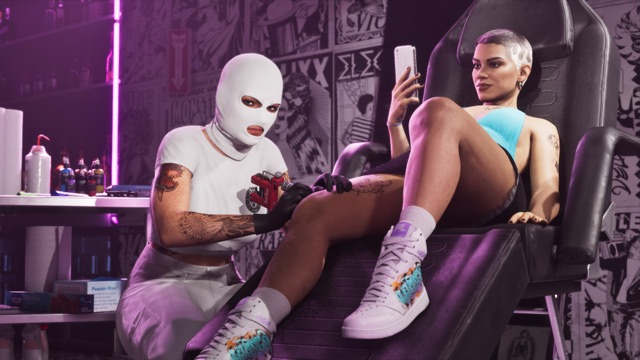 In a parlor papered with black-and-white flash art, a tattoo artist in a white balaclava works on the leg of a woman reclining in a black chair while she looks at her phone.