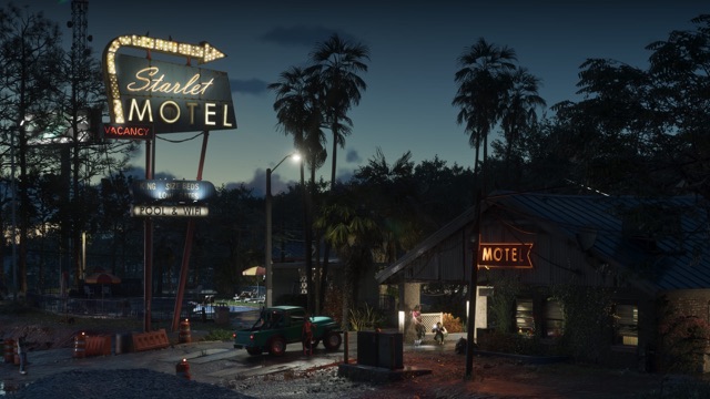 A motel at dusk under palm trees, with a tall neon sign reading Starlet Motel by the road.