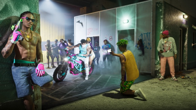 Official screenshot of the PTT Youngin$ Illegal Goods Store: at night in an alley, a crowd films two riders doing a burnout on a teal and pink dirt bike.