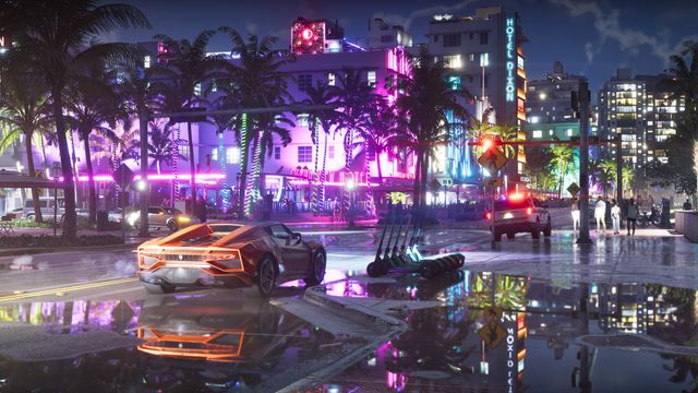 An orange sports car on a rain-soaked street at night outside an art deco hotel with pink neon signs reading Ocean View Hotel.