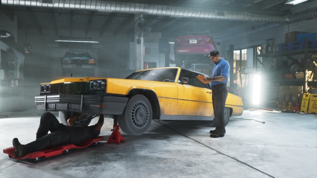 In the Rideout Customs workshop, a mechanic on a red creeper works under a yellow classic coupe on jack stands while a man in a blue shirt reads a clipboard.