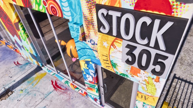 The Stock 305 sign in raised letters on a storefront covered in bright murals, with paint splatters on the sidewalk.