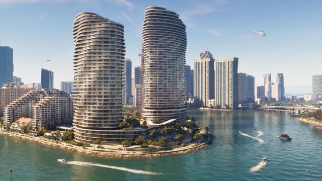 Two tall, curving towers rise from a palm-lined point on the Vice City waterfront, with speedboats trailing wakes across the water below.