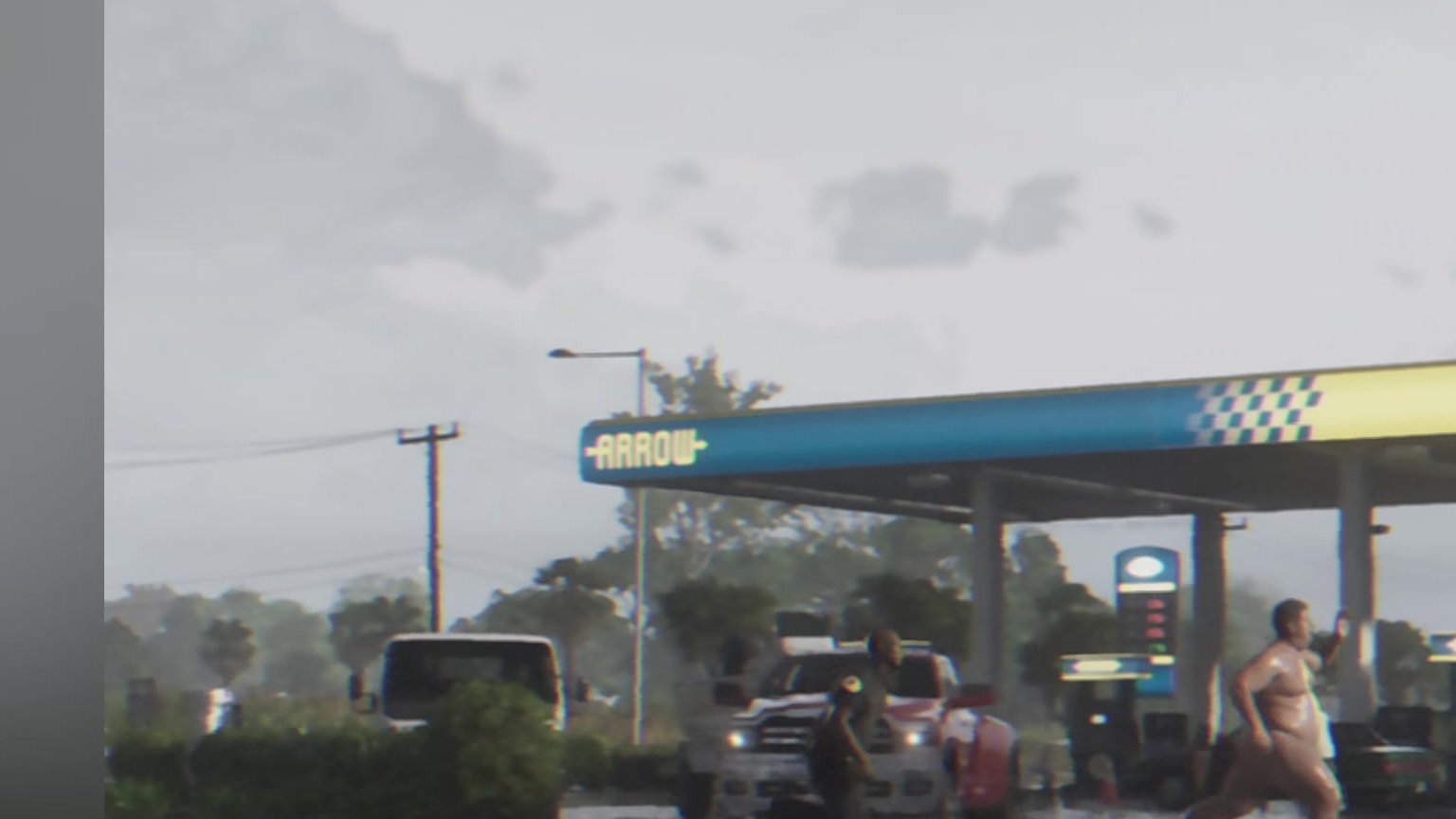 People on a gas station forecourt under a blue canopy that reads Arrow.