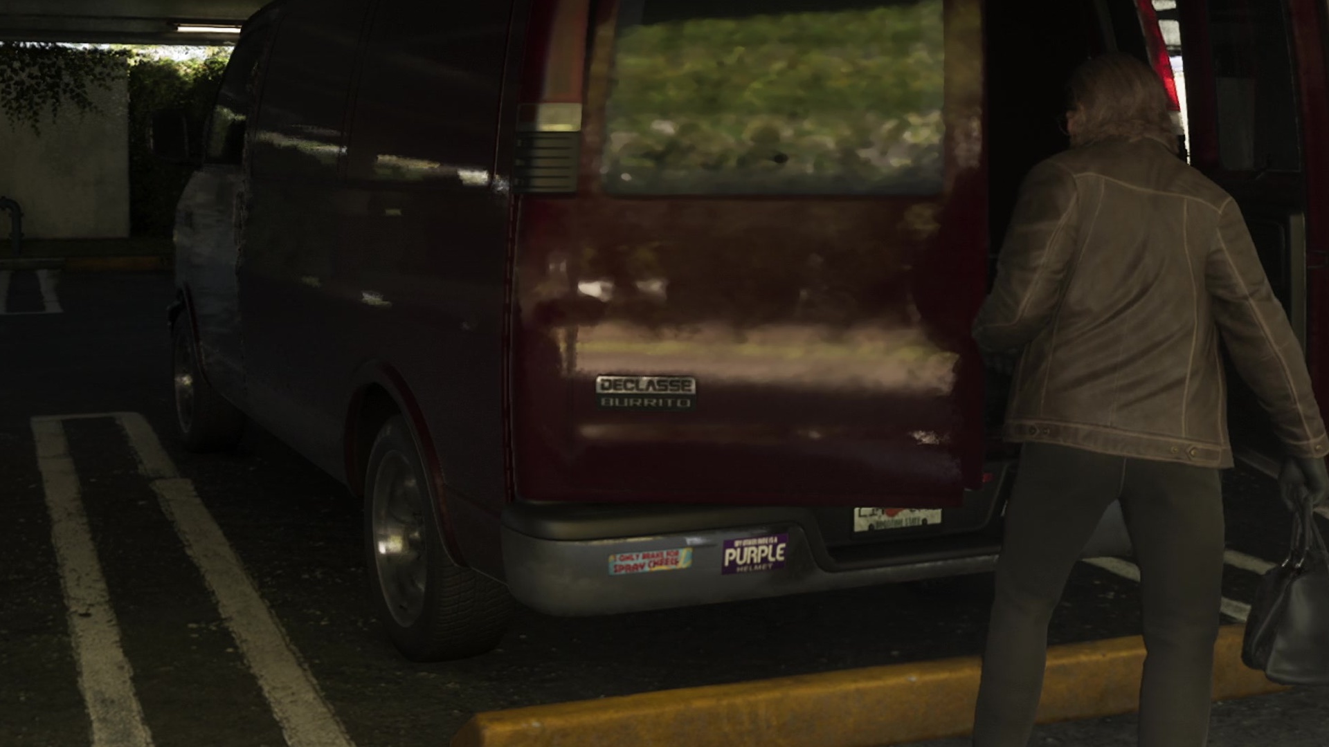 A woman loads a dark red van with a Declasse Burrito badge on its back door.