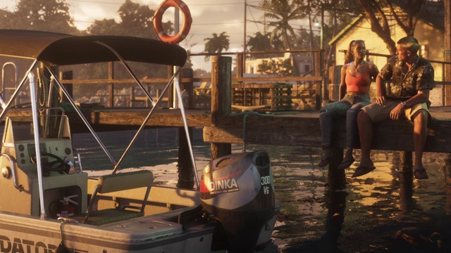 Two people sit on a dock at sunset beside a boat with a Dinka 300 V6 outboard motor.