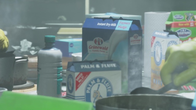 A Palm and Flute box beside a Grünewald instant dry milk carton on a cluttered counter.